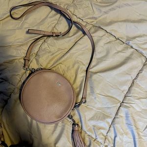 Barely used beije Coach purse. Leather, cross body.